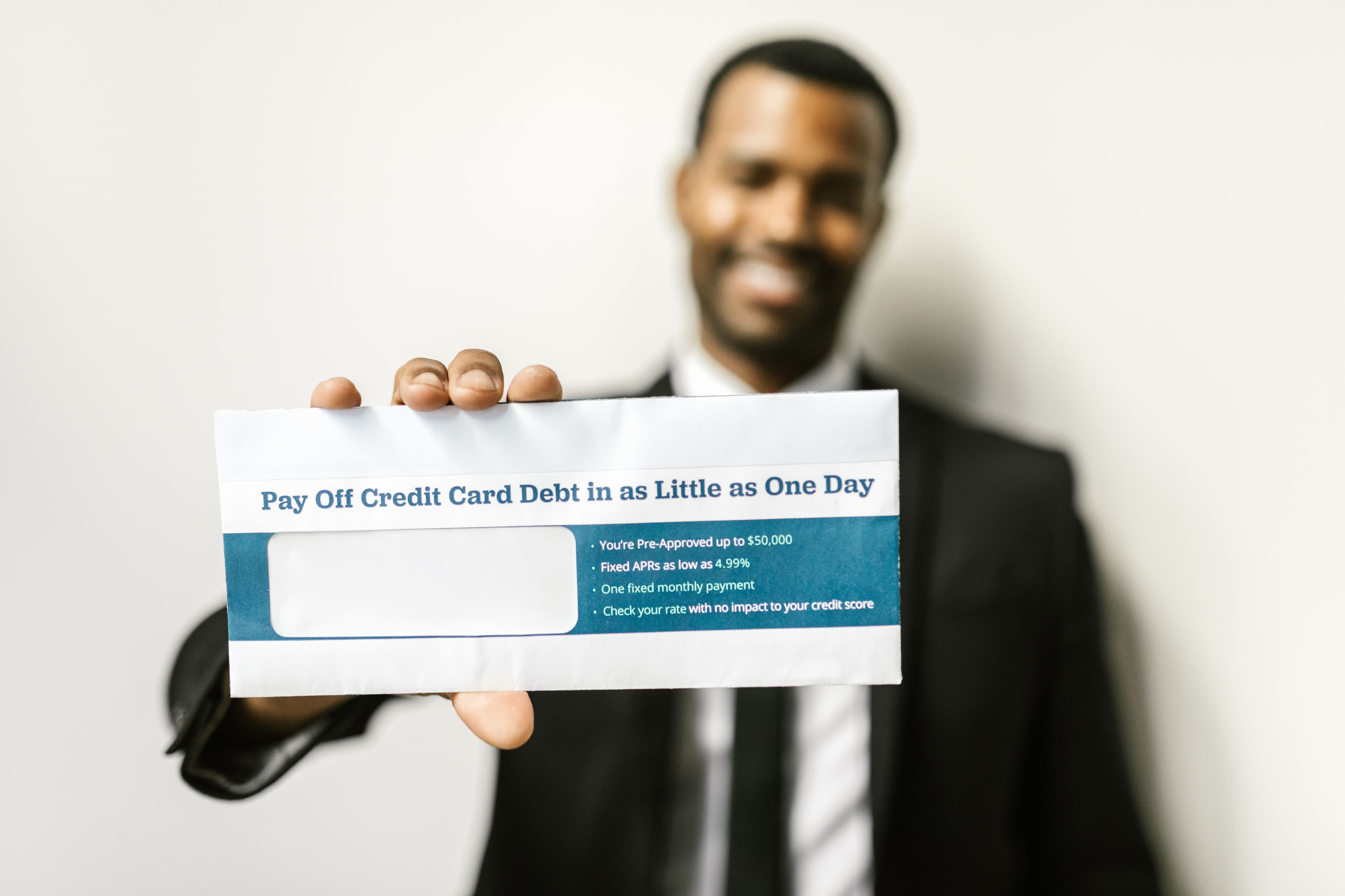 Credit cards with 0% APR prominently displayed, symbolizing debt relief.